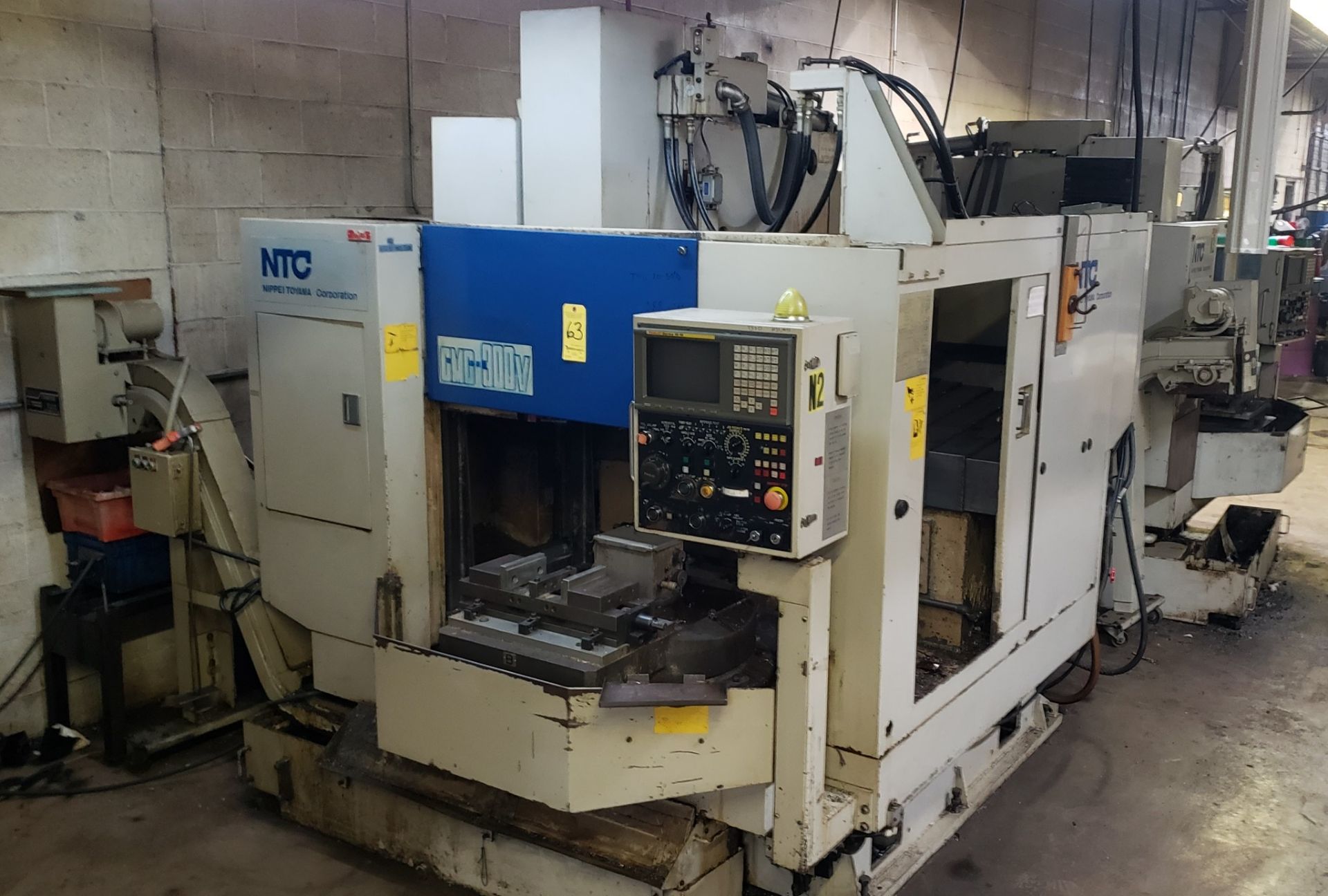 NC Nippei Toyoma CMC-300V w/Fanuc 16M Control, 3-Axis, A&B Pallet Chip Conveyor, Cat 40, 18 ATC 3-