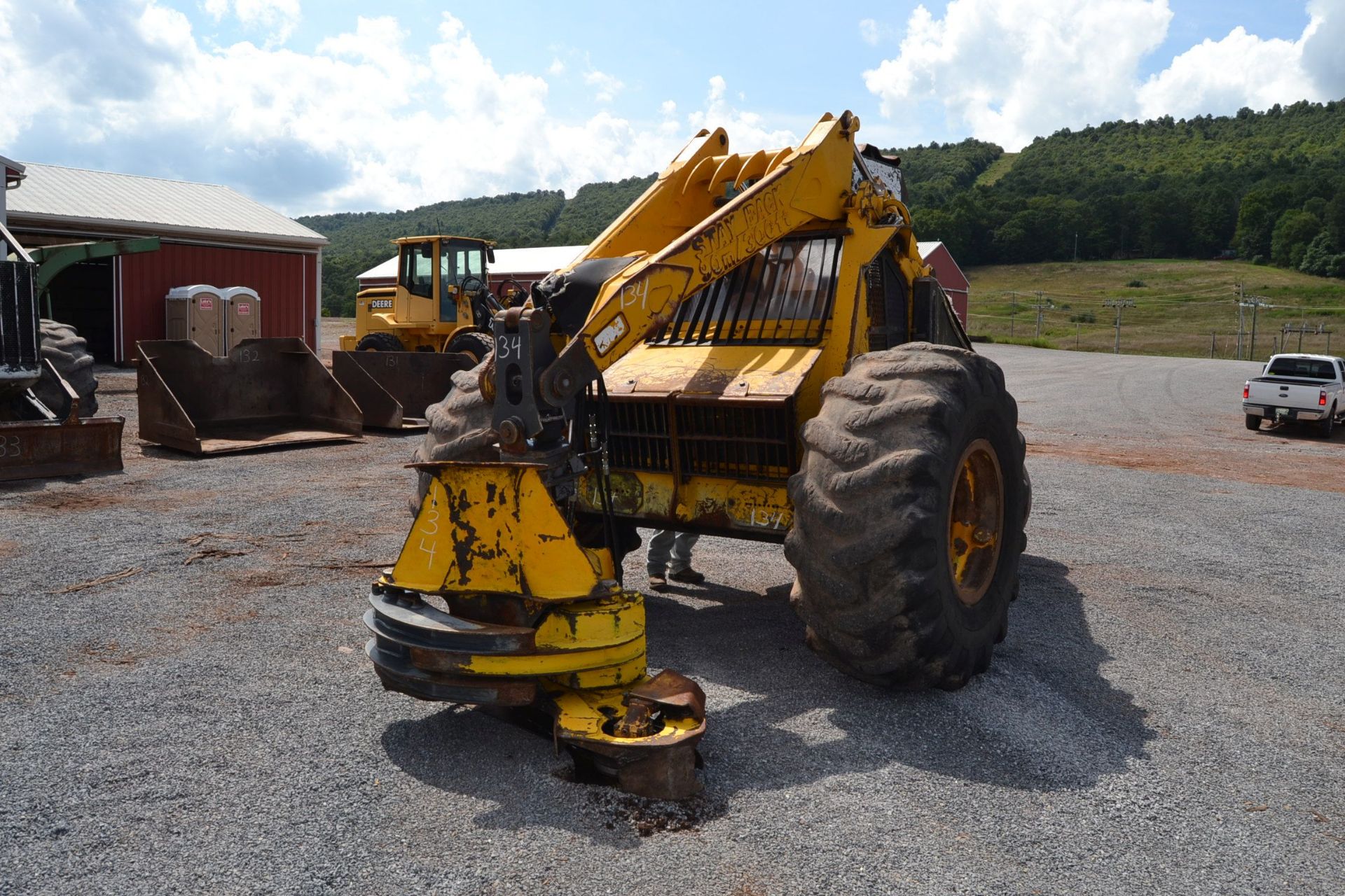 BELL ULTRA C 3 WHEEL FELLER BUNCHER W/ CUMMINS ENGINE W/ BAR SAW HEAD