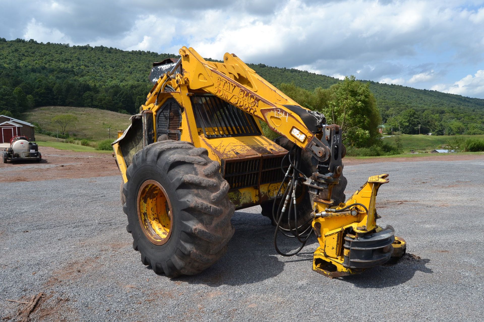 BELL ULTRA C 3 WHEEL FELLER BUNCHER W/ CUMMINS ENGINE W/ BAR SAW HEAD