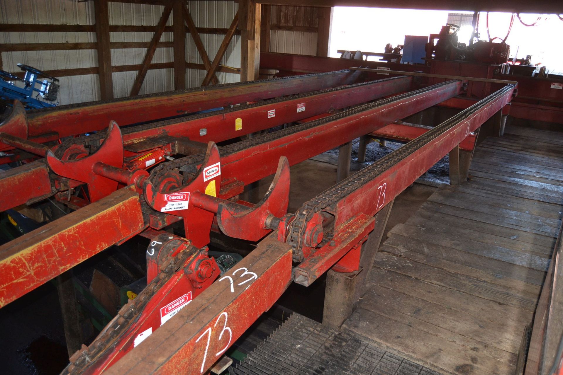 MELLOTT 30' 4 STRAND LOG DECK W/ NOSE SKIDS W/ 4 ARM STOP & LOADER W/ HYDRAULIC DRIVE