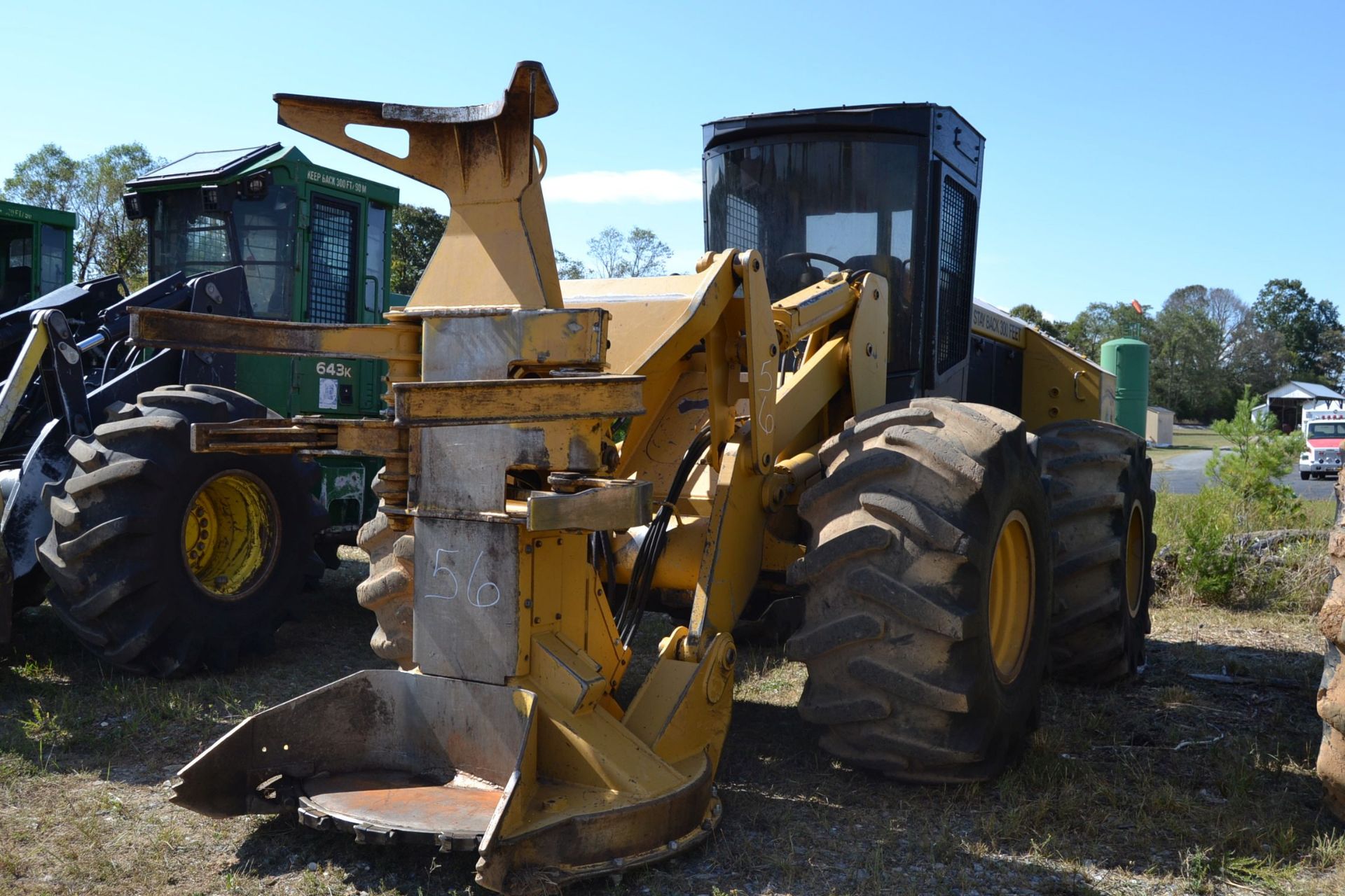 TIMBER KING TK350 FELLER BUNCHER W/ SAW HEAD W/ HEAT & AIR CAB W/ 28LX26 RUB SN#HA18672 9,023 HOURS