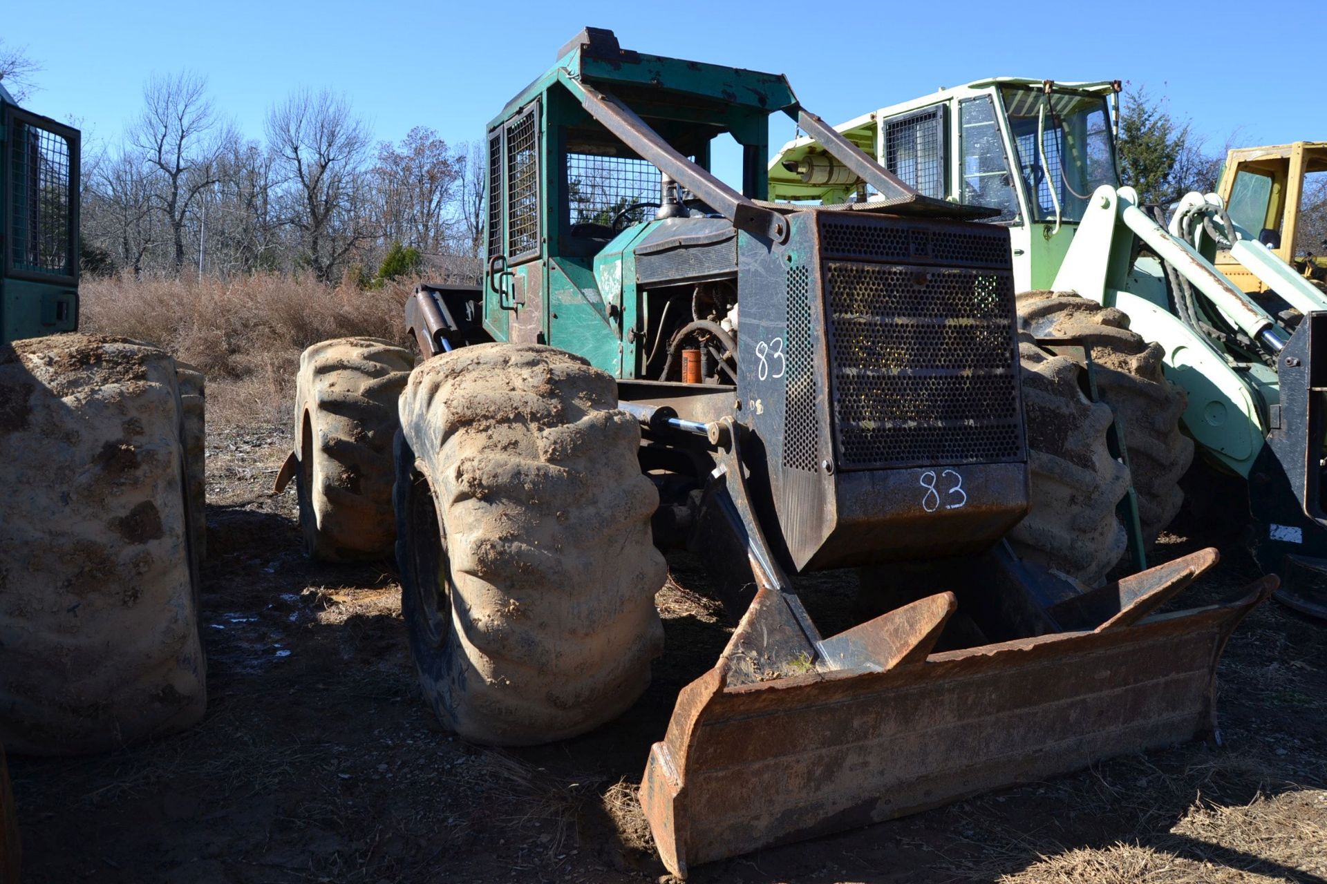 TIMBERJACK 450 GRAPPLE SKIDDER W/ WINCH W/ 28LX26 RUB W/ CUMMINS ENGINE 4,926 HOURS SN#CB4857 W/