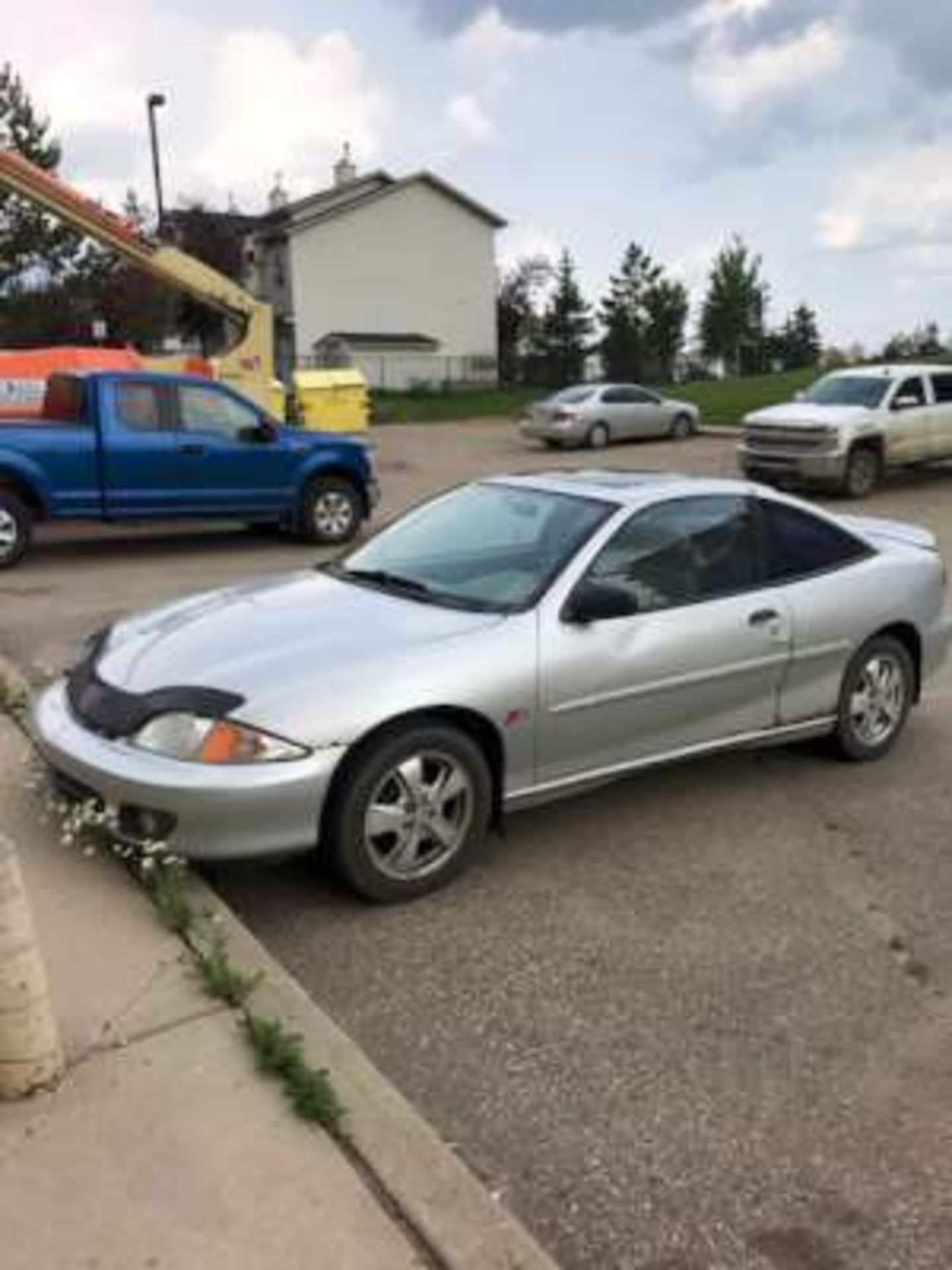 2001 Chevrolet Cavalier Z24, 2-door, 2.4L 4-cyl, manual transmission, silver paint, rust on both