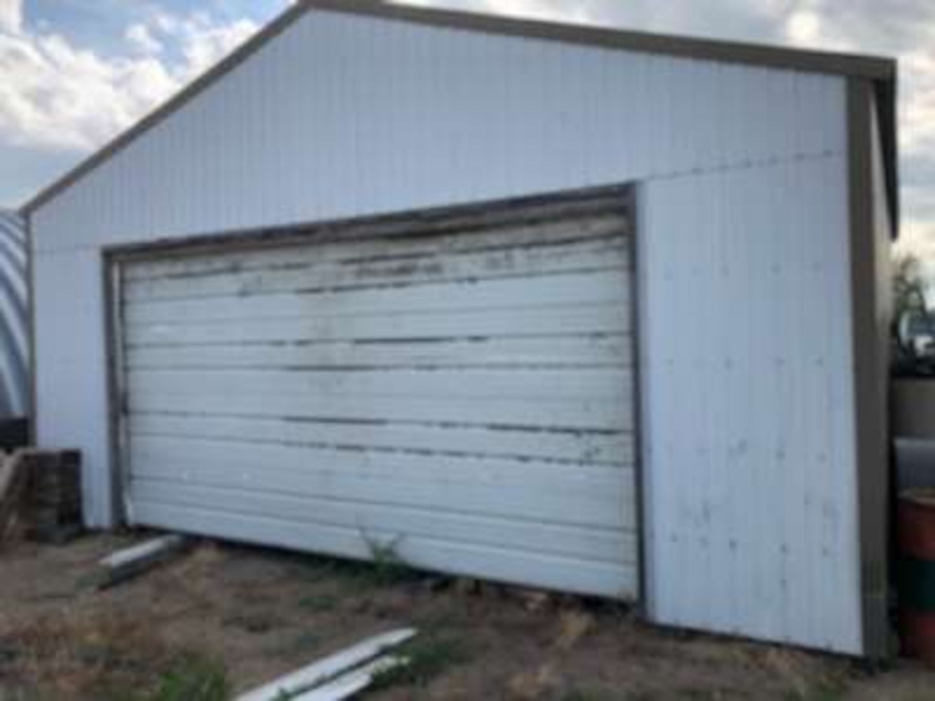 24ft x 24 ft farm shed building , metal roof and walls, 8 ft high x 16 ft wide door, metal