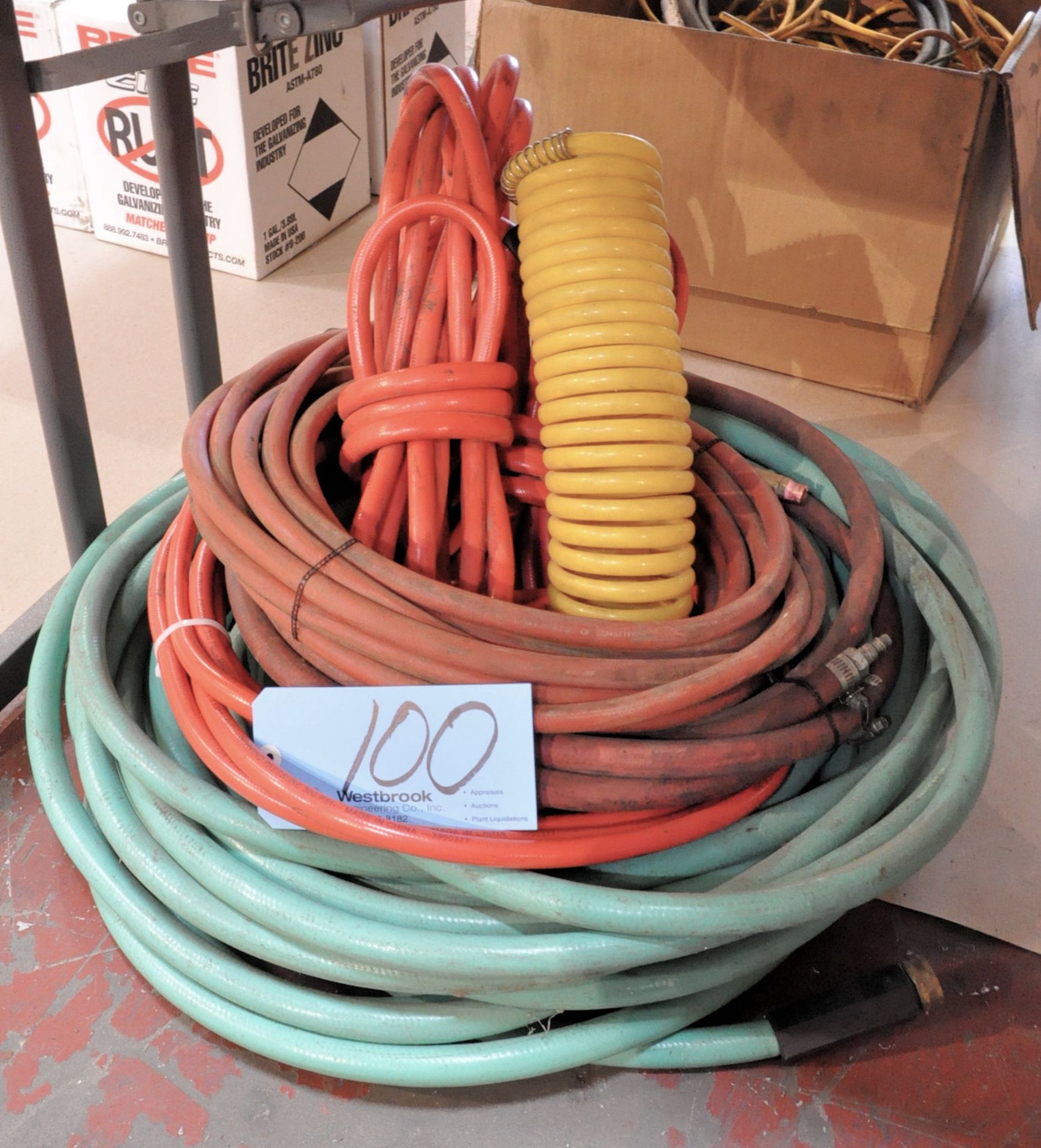 Lot-Air Hose and Garden Hose Under (1) Table