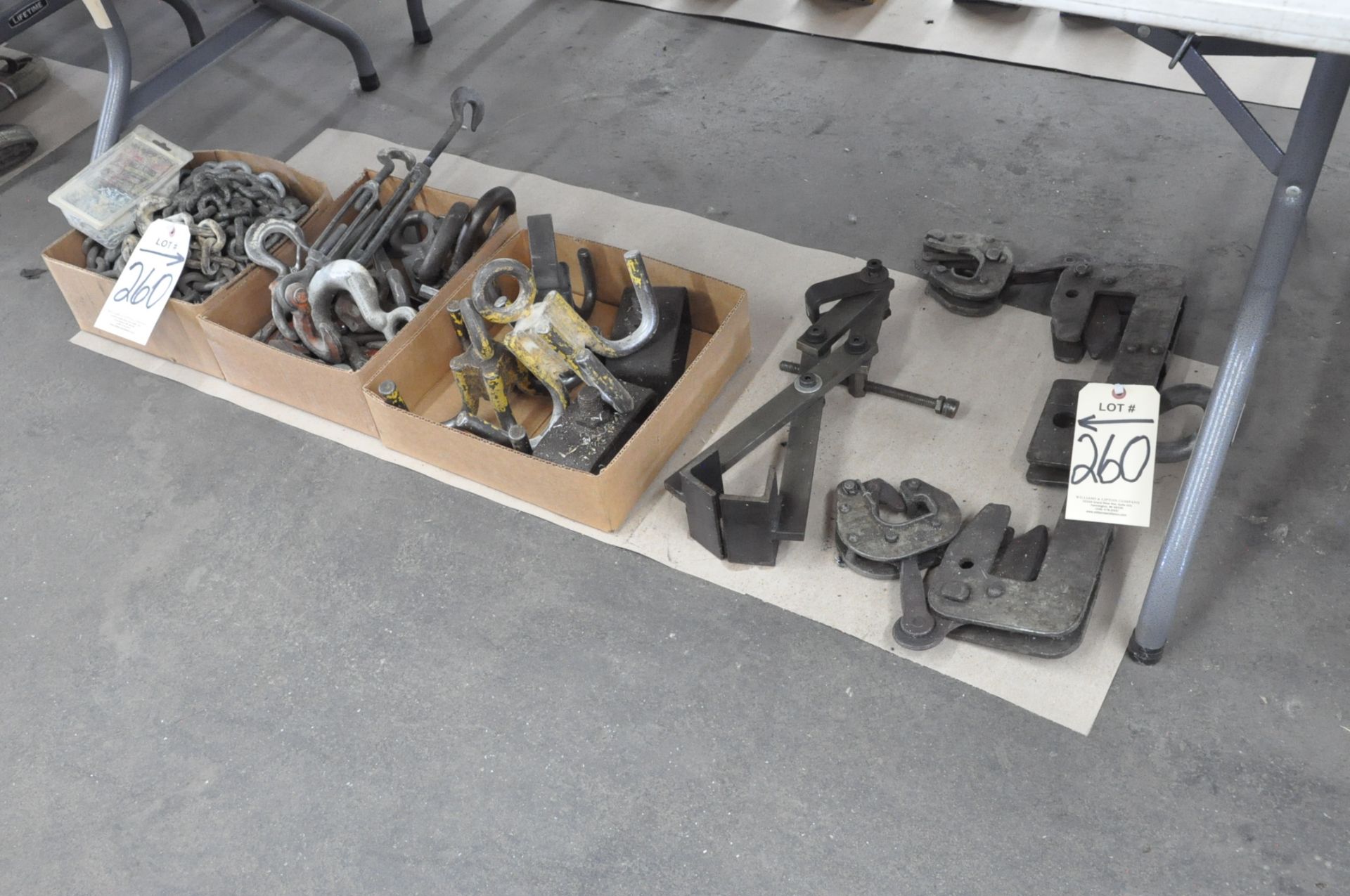 Lot-Various Chains and Hooks in (3) Boxes, Grabs and Spreader Bar Under (1)Table