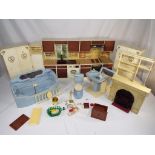 Sindy - A selection of vintage Sindy furniture comprising a fireplace, kitchen, cooker,