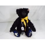 Steiff - Black Bear, Growler Special Edition HRH coat of arms on foot, Prince Charles Bear,