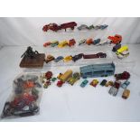 Matchbox and Dinky - In excess of thirty five unboxed diecast vehicles in playworn condition,