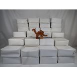 Sixty five unused novelty wooden carved soil-dinosaurs in original boxes (2)