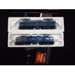 Model Railways - Tri-ang OO gauge - two Class 77 electric locomotives in associated boxes with a