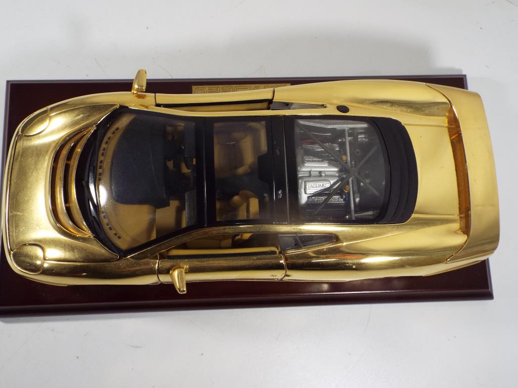Jaguar - a rare 1:18 scale gold plated Jaguar XJ220 on wooden plinth with original presentation box, - Image 4 of 4