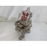 A cast iron novelty mechanical money bank in the form of a robot.