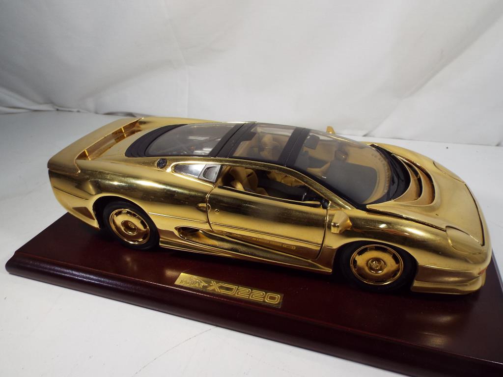 Jaguar - a rare 1:18 scale gold plated Jaguar XJ220 on wooden plinth with original presentation box, - Image 3 of 4