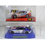 Scalextric - two slot cars comprising Huyndai rally car in associated box and a Maserati Trofeo in