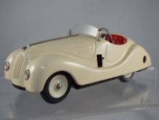 Schuco - #4001 Examico, cream tinplate clockwork unboxed car with four speed and reverse gears,