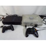 A lot to include an Xbox Crystal Console with S controller and a Playstation 2 with controller.