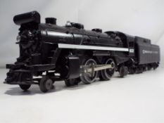 A Lionel train and tender featuring Chesapeake, Ohio.
