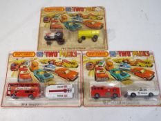 Matchbox - three two pack diecast sets in original blister packs comprising TP-2 Tractor and