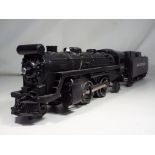 A Lionel train and tender featuring New York Central.