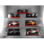 Minichamps - a collection of seven 1:43 scale F1 cars with a McLaren theme,