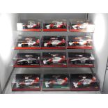 Minichamps - a collection of twelve 1:43 scale F1 cars with a McLaren theme,