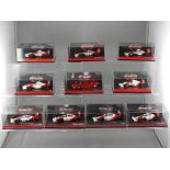 Minichamps - a collection of ten Minichamps 1:64 scale F1 cars with a McLaren theme,