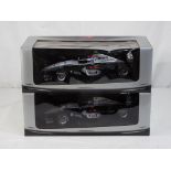 Minichamps - two 1:18 scale diecast McLaren F1 cars by Minichamps with a West Tobacco branding,