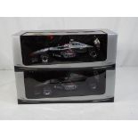 Minichamps - two 1:18 scale diecast McLaren F1 cars by Minichamps with a West Tobacco branding,