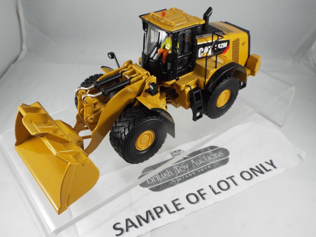 Diecast - three excavators in original boxes, comprising Diecast Masters CAT 982M Wheel Loader, - Image 2 of 3