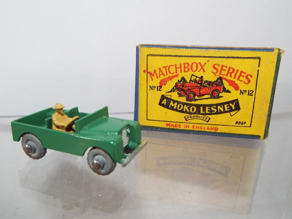 Matchbox by Lesney - a diecast model Land Rover with tan driver figure # 12, green with silver trim,