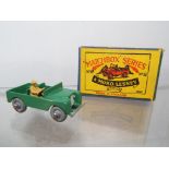 Matchbox by Lesney - a diecast model Land Rover with tan driver figure # 12, green with silver trim,
