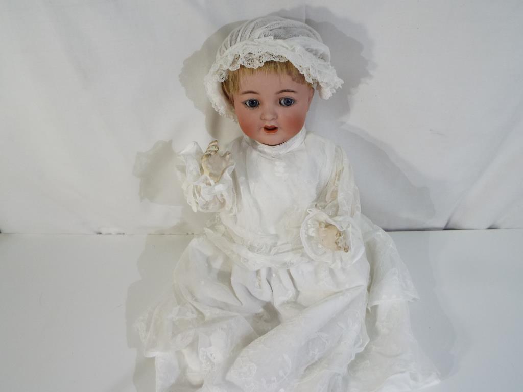 Schoenau & Hoffmeister - a bisque headed doll, sleeping blue eyes, open mouth,