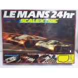 Scalextric - a Le Mans 24 hour set with two cars and four additional (for spares) set appears to be