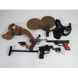 A good mixed lot of vintage toys including four cap guns including Crescent Luger,