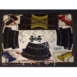 A Scalextric Grand Prix 80 set, with three spare cars, two controllers and two transformers,