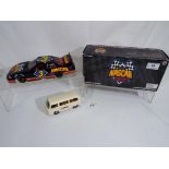 Two tinplate toys - Nascar Cafe Orlando 1998 Pontiac issued in a limited edition in original box