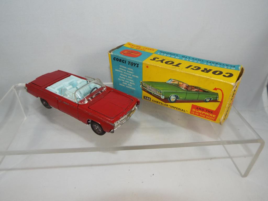 Corgi - a diecast model Chrysler Imperial, red body with pale blue interior, opening doors,