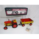 Schylling - a tinplate and clockwork Tractor and Trailer,