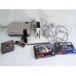 Gaming - Nintendo - a Nintendo entertainment system console with controller and punch-out game