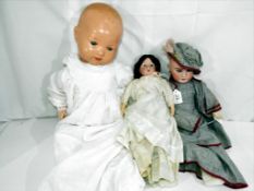 A collection of three good quality vintage dolls to include a boy Armand Marseille marked to the