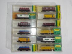 Model Railways - Minitrix - twelve boxed items of N gauge rolling stock by Minitrix, includes 3239,