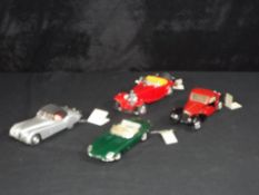 Diecast - Franklin Mint - a collection of four unboxed 1:24 scale Franklin Mint models cars,