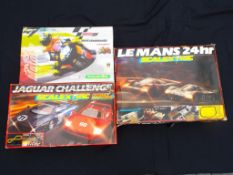 Three Scalextric sets comprising Le Mans 24 Hr, Jaguar Challenge and Moto GP,