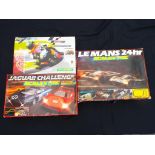 Three Scalextric sets comprising Le Mans 24 Hr, Jaguar Challenge and Moto GP,