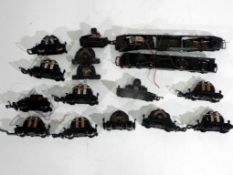 Model Railways - sixteen Hornby /Tri-Ang OO gauge motors with some chassis,