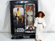 Star Wars by Kenner and Hasbro - an unboxed vintage large scale action figure of Princess Leia and