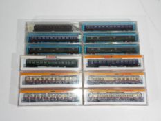 Model Railways - Atlas, Roco, Arnold - a collection of twelve boxed items of N passenger coaches,