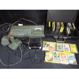 Vintage Gaming - A Spectrum 128K +2 personal computer with joystick and games,