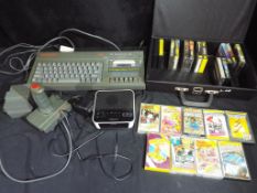 Vintage Gaming - A Spectrum 128K +2 personal computer with joystick and games,